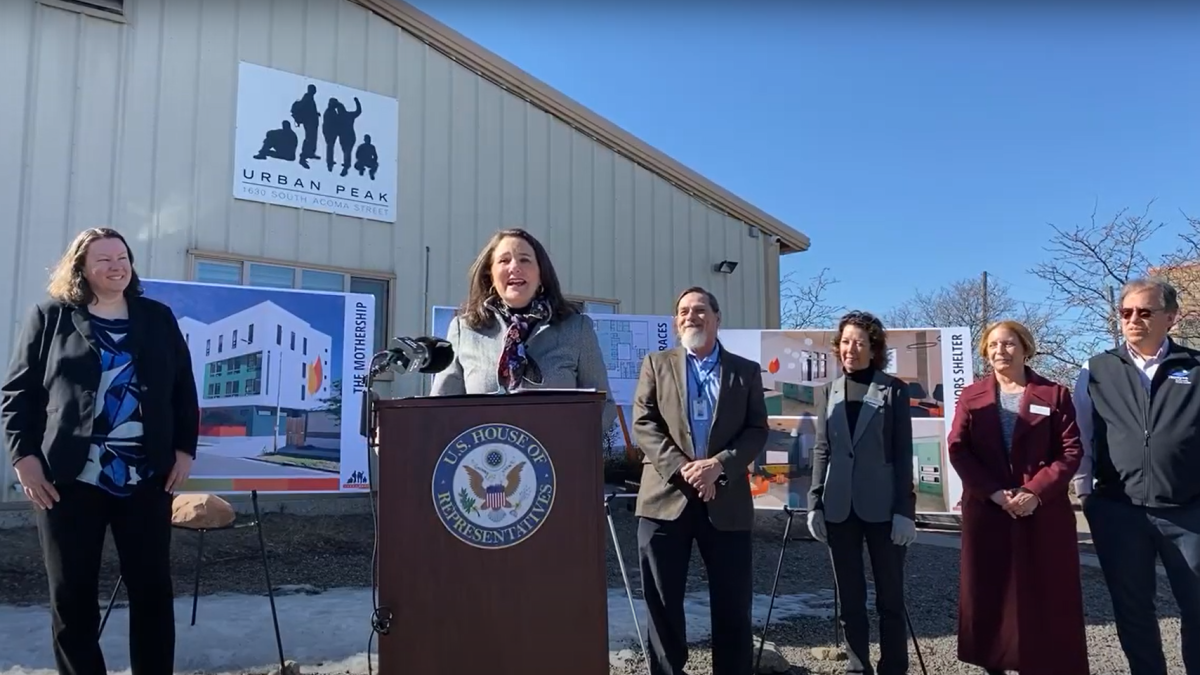A photo of a press conference with Rep. DeGette and local leaders in front of Urban Peak in Denver, CO.