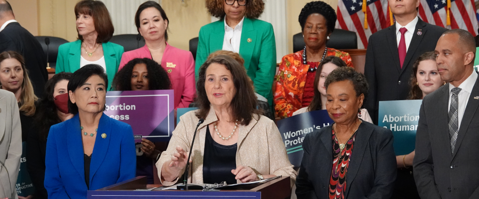 A photo of a press conference with Rep. DeGette speaking